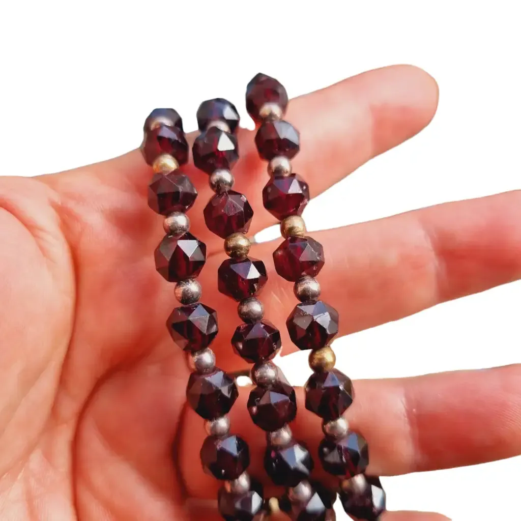 Antique silver modernist bracelet, floral motif and garnet glass beads.
